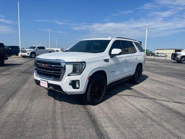 2023 GMC Yukon AT4 in Summit White — front three-quarter view