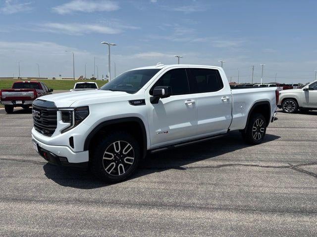 2023 GMC Sierra 1500 AT4 in Summit White — front three-quarter view