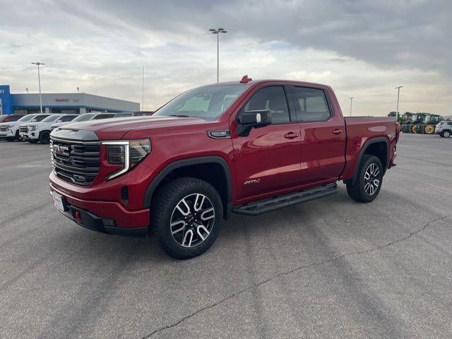 2024 GMC Sierra 1500 AT4 in Volcanic Red Tintcoat — front three-quarter view