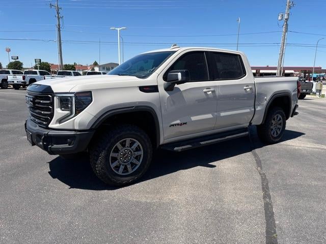 2026 GMC Sierra 1500 AT4X in Coastal Dune — front three-quarter view